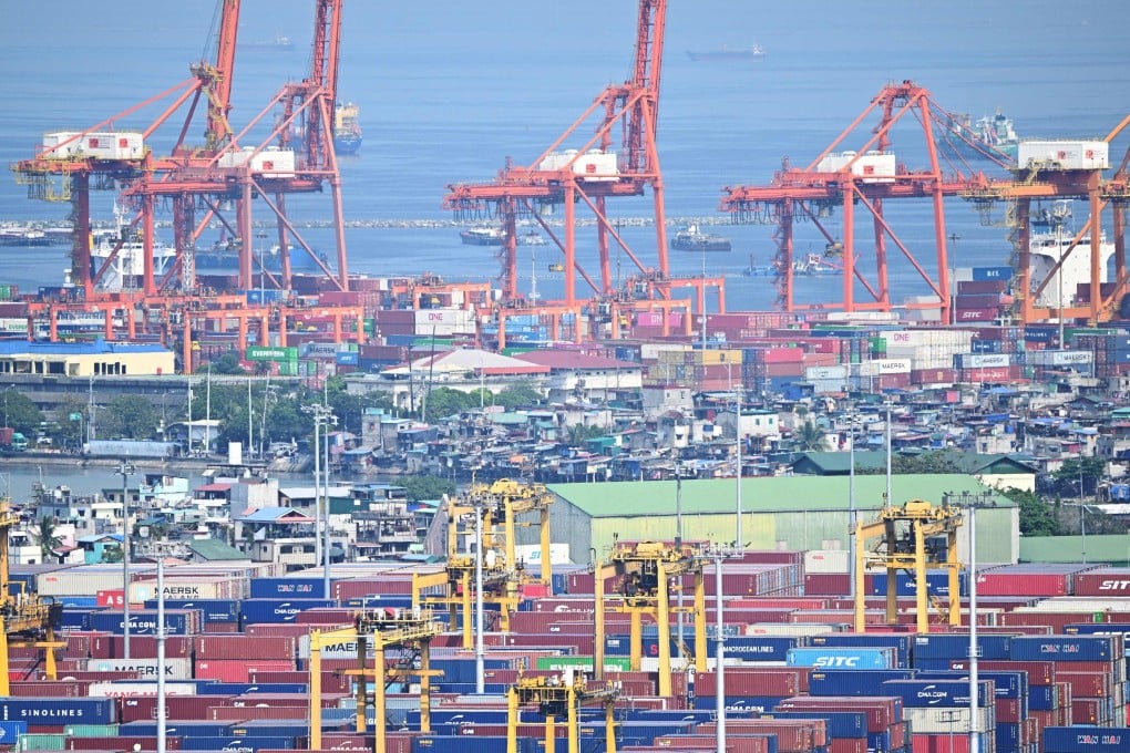 Containers and cranes at the international Port of Manila on April 3, The proposed railway will be extended all the way to Manila. Photo: AFP