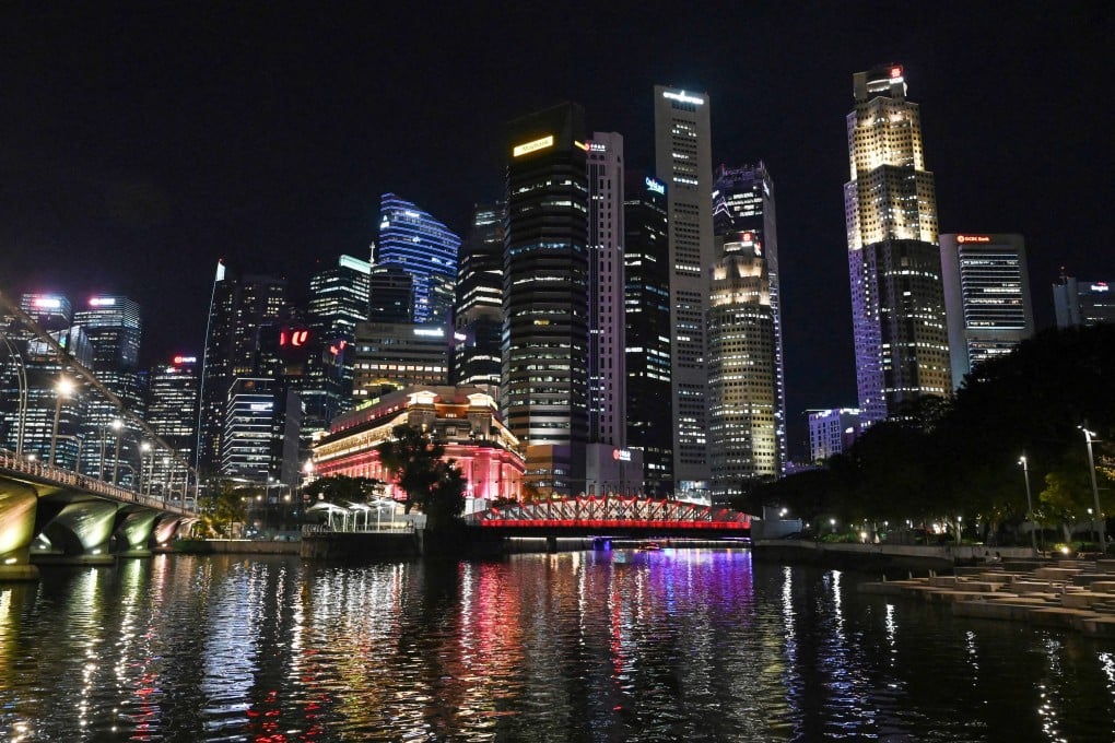 Singapore’s financial business district seen at night. The city state expects to meet around one-third of its power demand from clean electricity imports by 2035. Photo: AFP