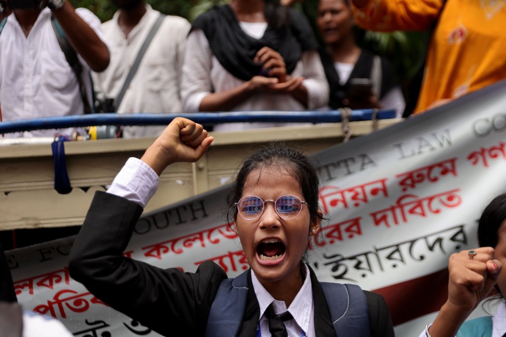 Law students shout slogans as they take part in a protest march on Monday after a 24-year-old law student was allegedly raped on the campus of South Calcutta Law College on June 25. Photo: EPA