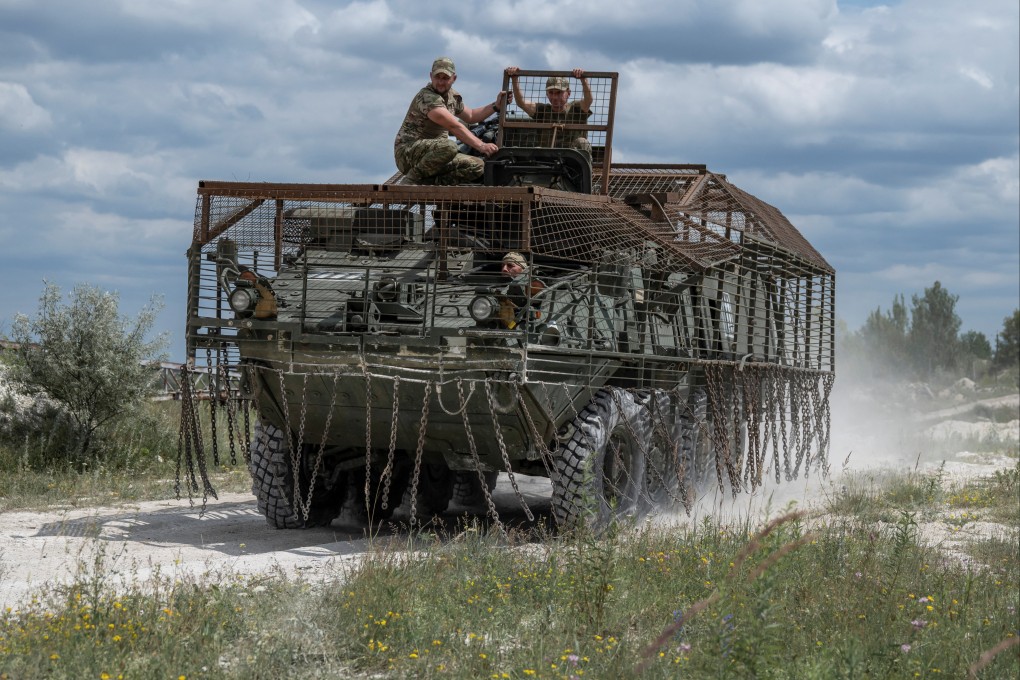 Ukrainian forces in a modified armoured personnel carrier in the Donetsk region, Ukraine. Photo: Reuters