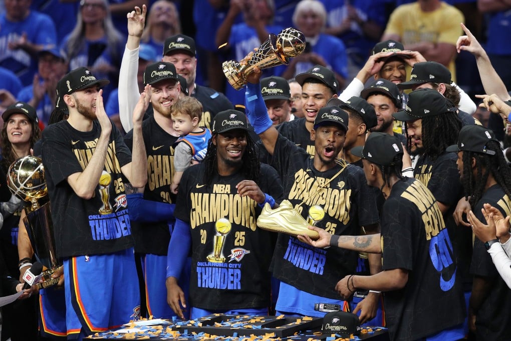 Shai Gilgeous-Alexander of the Oklahoma City Thunder celebrates with the Bill Russell NBA Finals MVP trophy after beating the Indiana Pacers, 103-91, in Game 7. Photo: Getty Images