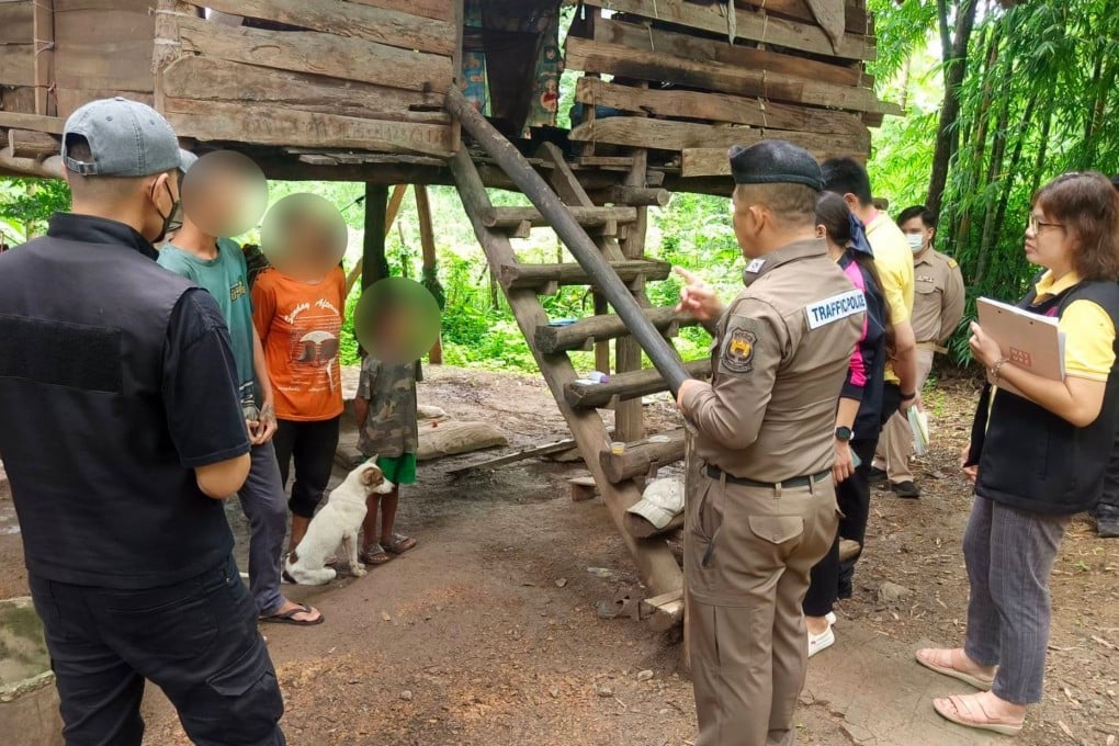 The eight-year-old boy, his mother and older brother at their home in northern Thailand. Photo: Handout