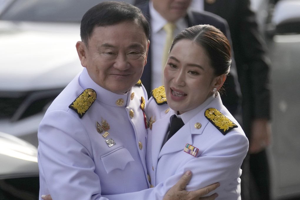Thaksin Shinawatra (left) hugs his daughter and newly elected prime minister, Paetongtarn Shinawatra, at Pheu Thai party headquarters in Bangkok last August. Photo: AP