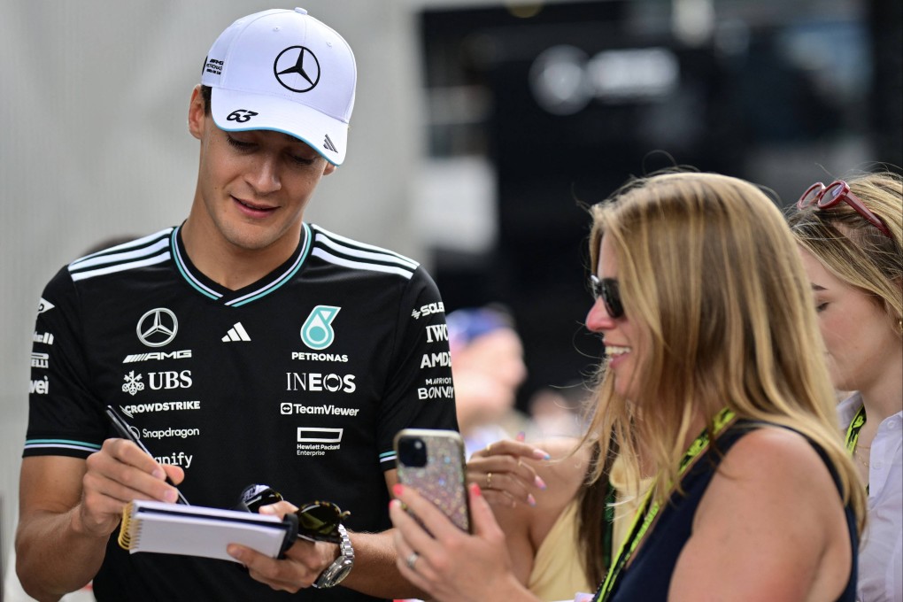 Mercedes’ British driver George Russell signs autographs at the Red Bull Ring race track in Spielberg, ahead of the Austrian Grand Prix. Photo: AFP