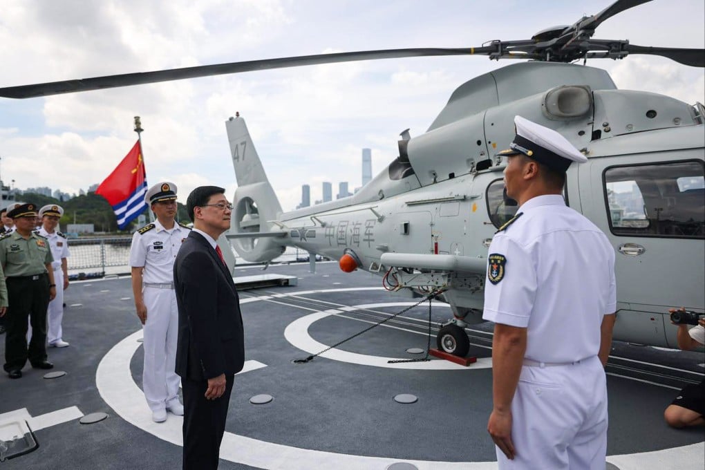 Chief Executive John Lee (centre) inspects the warship Shandong. Photo: Handout