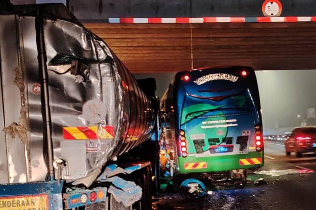 A tour bus and two trucks were involved in a crash near Ayer Hitam, Malaysia, on Thursday. Photo: Facebook/bombajdt