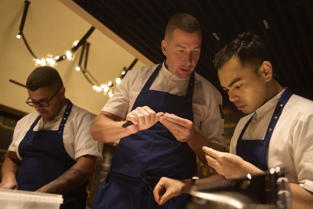 Executive chef Torsten Vildgaard (centre) and his staff prepare food at FZN by Bjorn Frantzen in Dubai, which has more restaurants per capita than any major city except Paris. Photo: AP