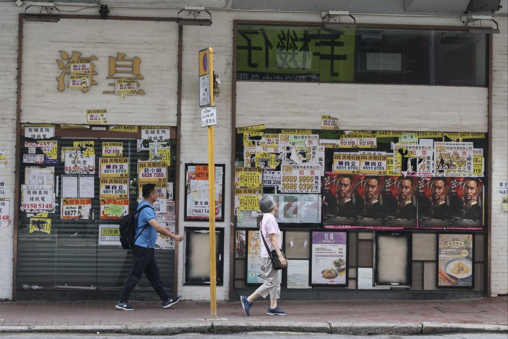 People walk past a recently closed Ocean Empire congee shop in Wan Chai on June 28. Photo: Edmond So
