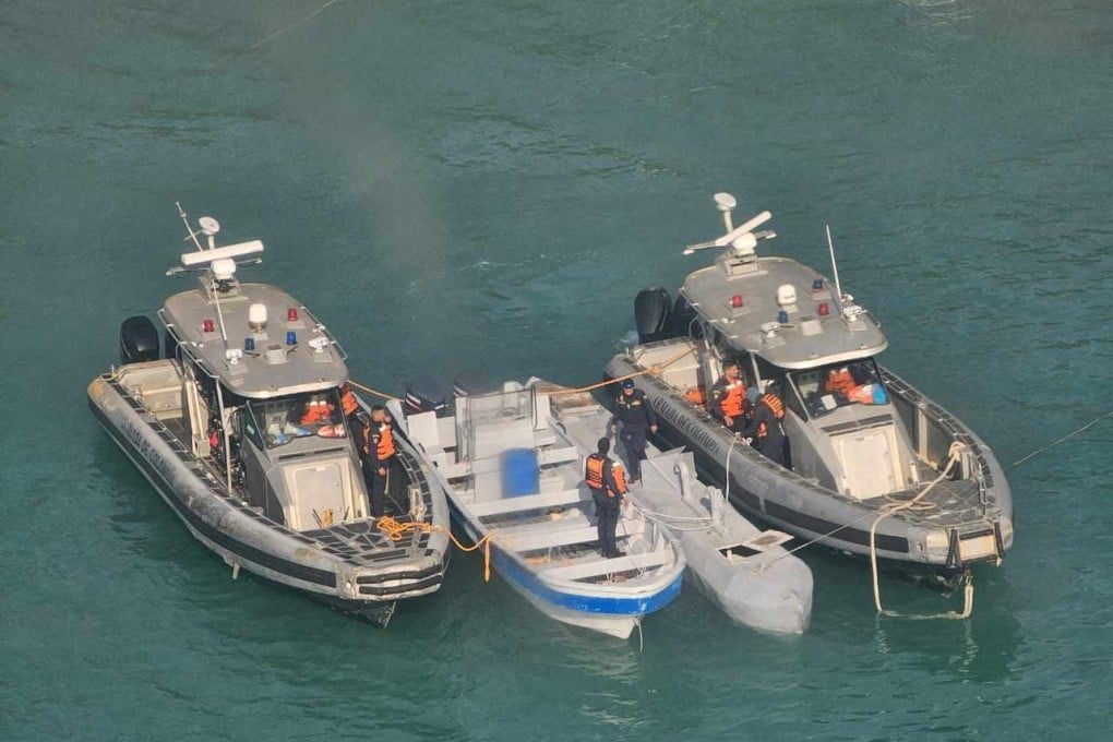 An unmanned semi-submersible between two Colombian Navy boats on July 2, 2025. Photo: Colombian Navy via AFP