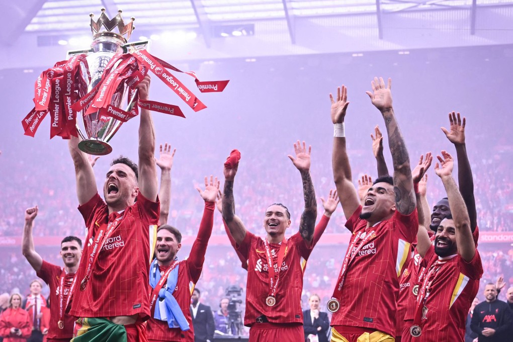 Liverpool’s Diogo Jota lifts the Premier League trophy at the end of the game against Crystal Palace at Anfield. Photo: AFP