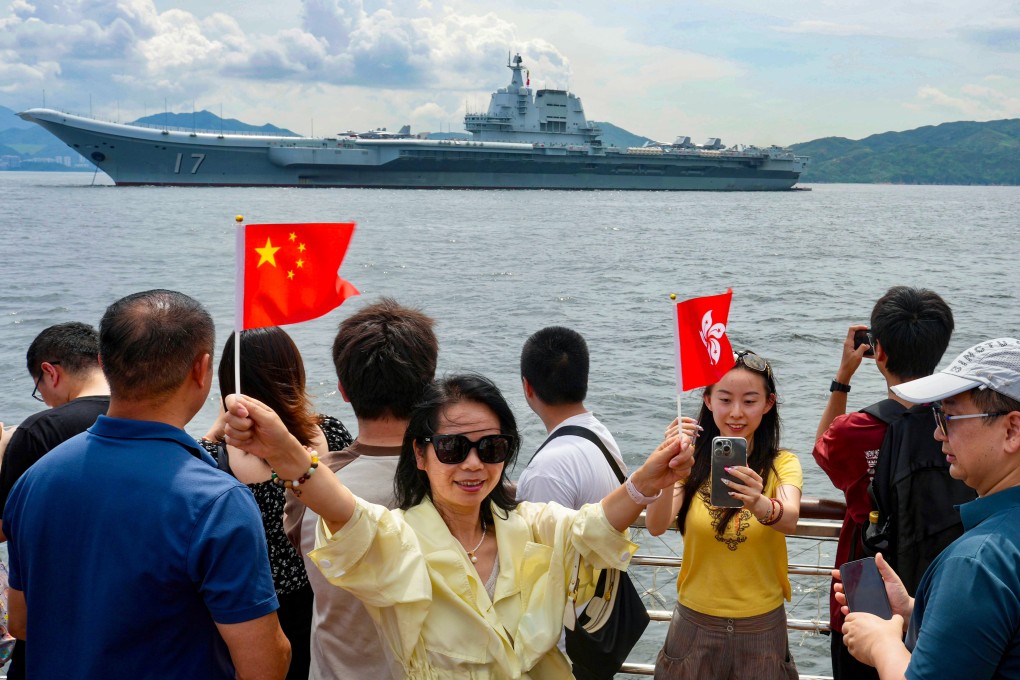 Visitors take a boat trip to get a closer look at the Shandong. Photo: Sam Tsang