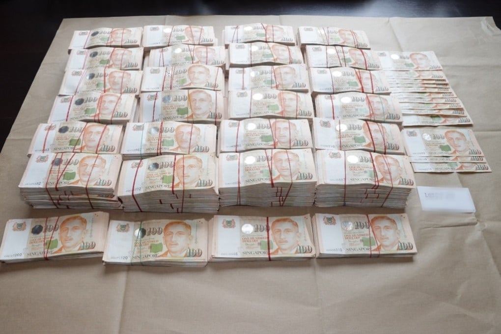 Singapore bank notes seized during an anti-money laundering raid in Singapore in 2023. Photo: EPA-EFE