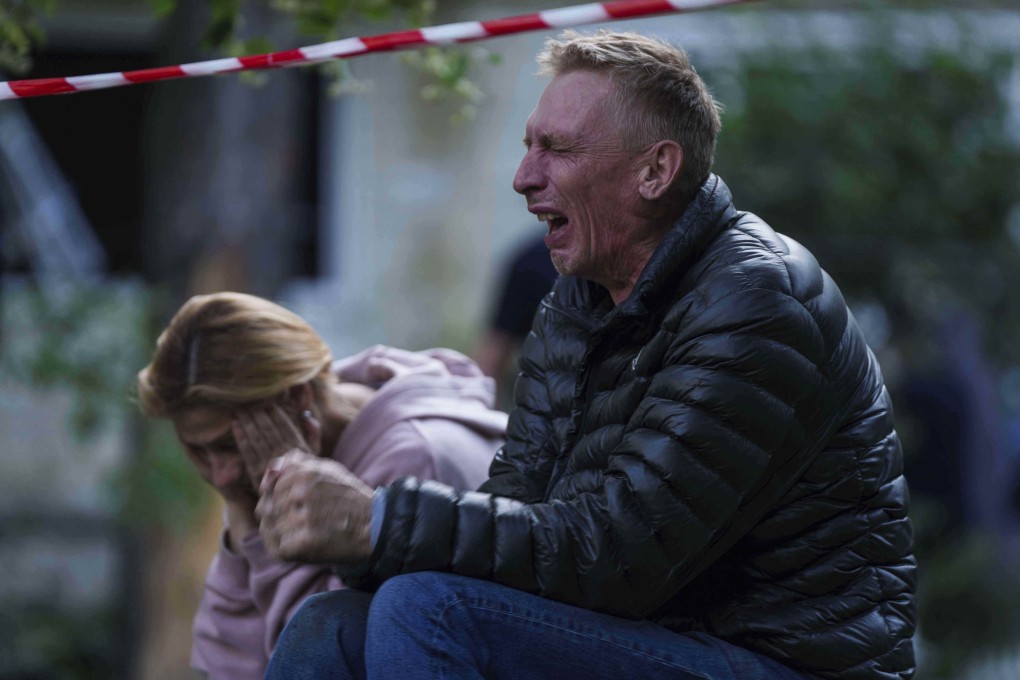 A father cries as his son is under the rubble of a multi-storey house destroyed by a Russian strike in Kyiv last month. Photo: AP