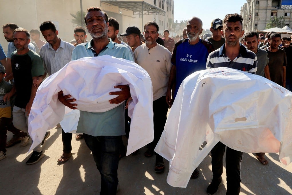 Mourners carry the bodies on Thursday of Palestinians who Gaza’s health ministry say were killed in an Israeli strike on a tent. Photo: Reuters