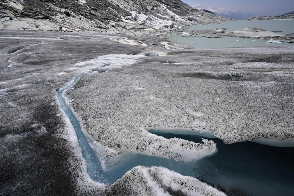 Water flows from the melting Rhone Glacier in Switzerland last month. Photo: AP