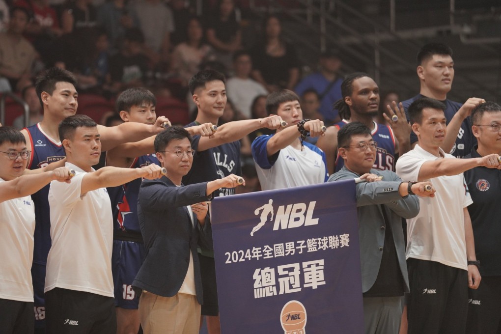 Hong Kong Bulls staff and players display their championship rings before the National Basketball League opener at Southorn Stadium last Saturday. Photo: Handout