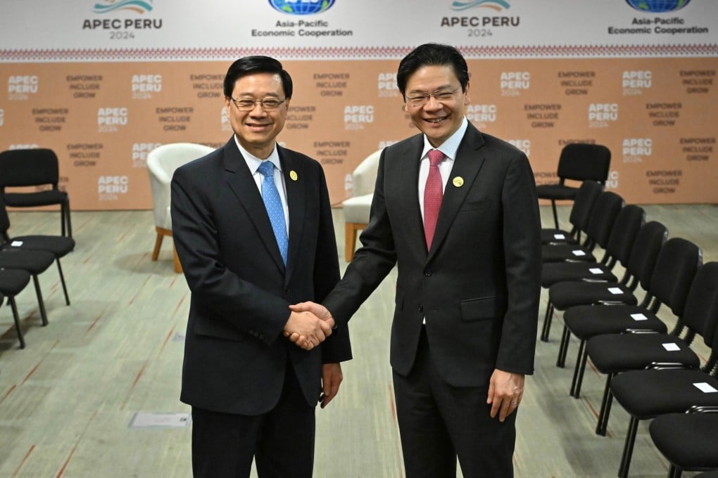 Hong Kong Chief Executive John Lee Ka-chiu and Singapore Prime Minister Lawrence Wong attend the Asia-Pacific Economic Cooperation (Apec) forum in Lima, Peru, on November 15, 2024. Photo: Handout