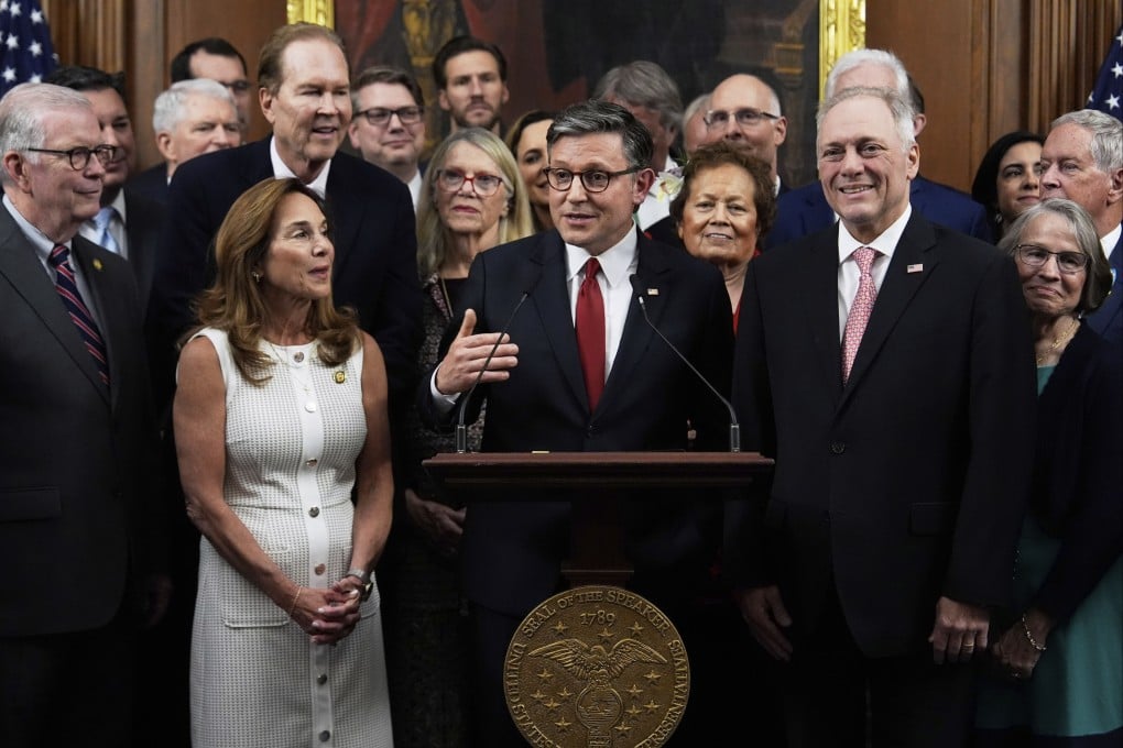 House Speaker Mike Johnson, surrounded by Republican members of Congress, speaking after the passage of the One Big Beautiful Bill Act at the Capitol on Thursday. Photo: AP
