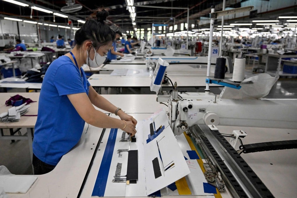 A worker stitches clothing at a garment factory in Vietnam. The United States has signed a trade deal with Vietnam that will impose 20 per cent tariffs on goods from the country. Photo: AFP