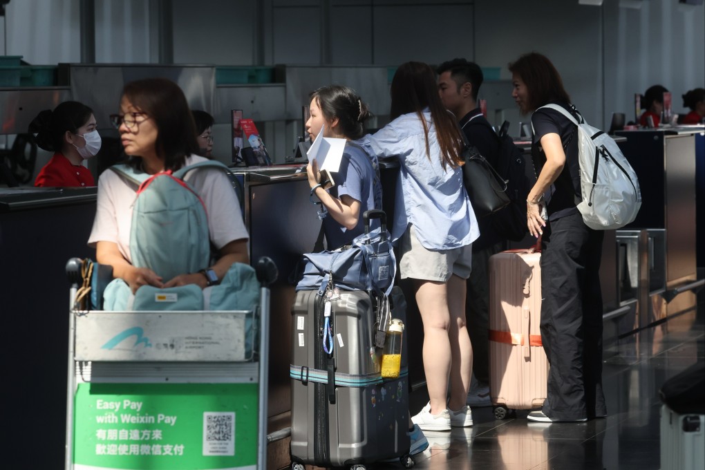 Travellers at Hong Kong International Airport’s departure hall. Photo: Edmond So