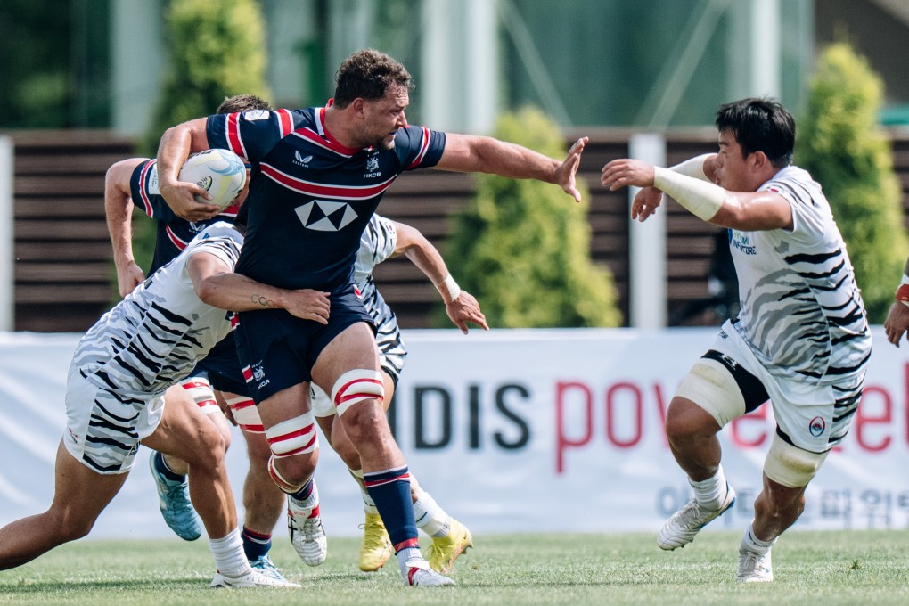 Hong Kong captain Josh Hrstich fends off the attention of a South Korea player at Incheon Namdong Asia Rugby Stadium. Photo: HKCR