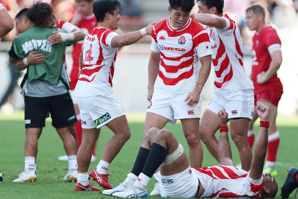 Japan players celebrate their victory in the rugby Test against Wales at the Mikuni World Stadium Kitakyushu in Kitakyushu on Saturday. Photo: AFP