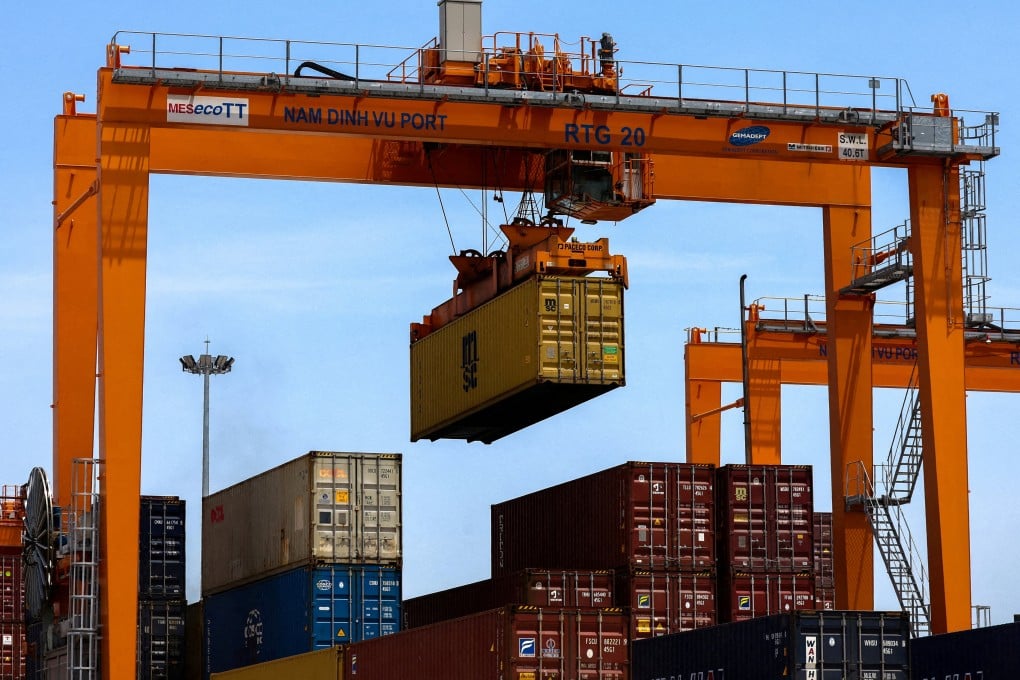 A container is loaded onto a cargo ship while docked at Hai Phong port in Vietnam. Photo: Reuters
