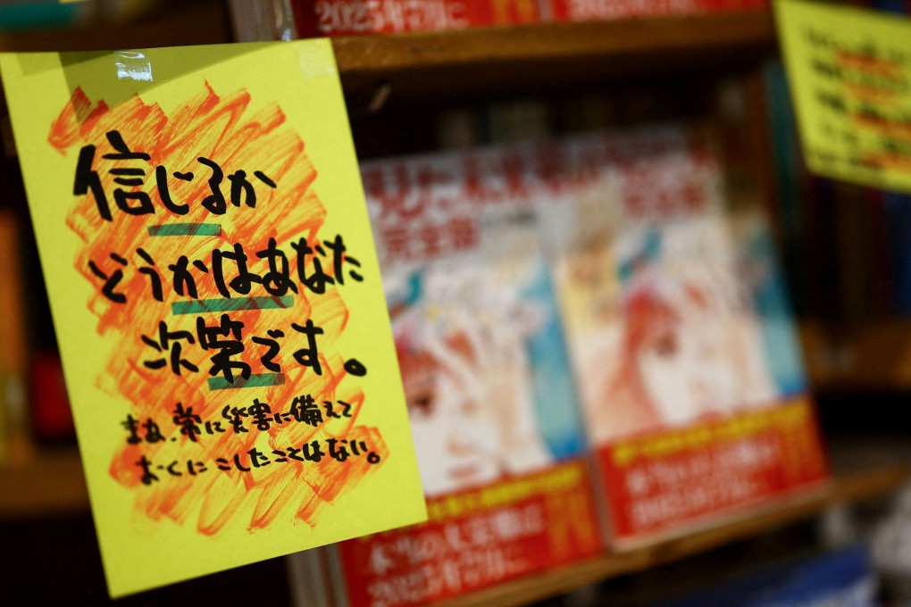 A store banner reading “Whether you believe it or not is up to you” is displayed next to Ryo Tatsuki’s manga titled The Future I Saw on Monday. Photo:  Reuters