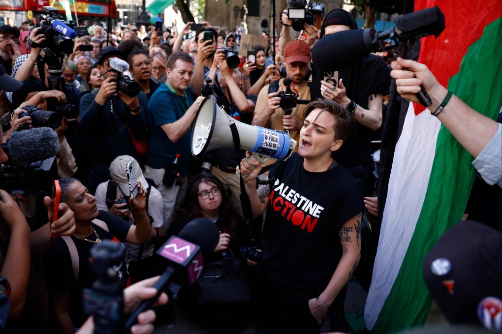 Palestine Action activist Lisa Luxx speaks to supporters and members of the media outside the High Court in London on Friday. Photo: AFP
