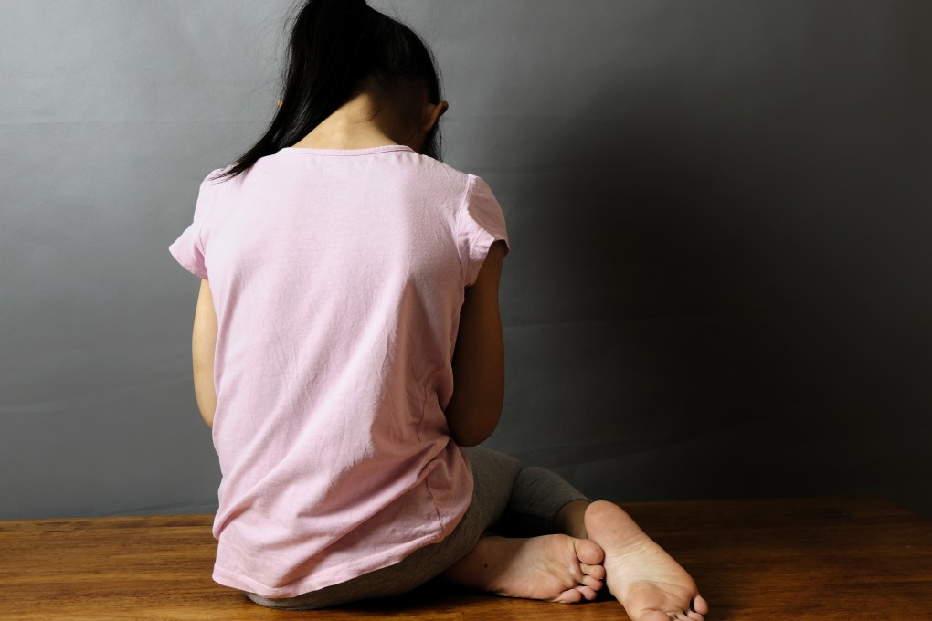 The back view of a girl, crying. A South Korean man has been arrested for child abuse in the Philippines. Photo: Shutterstock