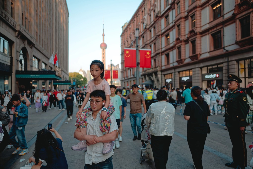 People walk along Nanjing street, a major tourism and shopping area in Shanghai, on May 1. Photo: EPA-EFE