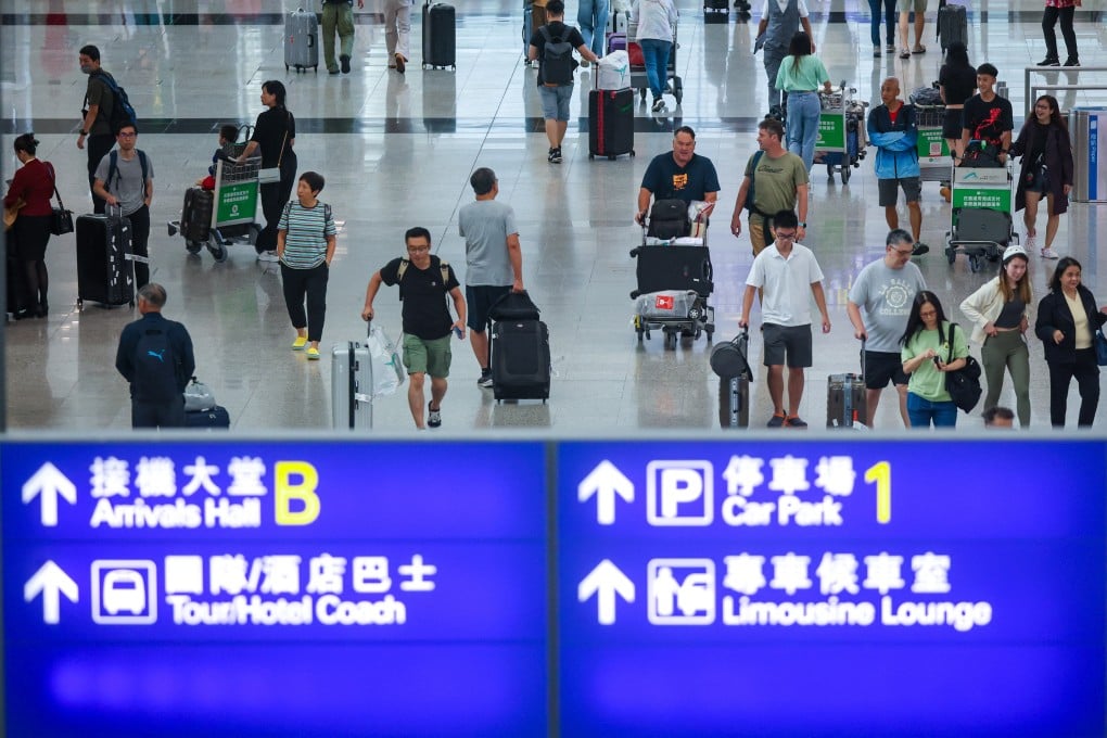 Travellers arrive at Hong Kong airport in 2023. Photo: Edmond So