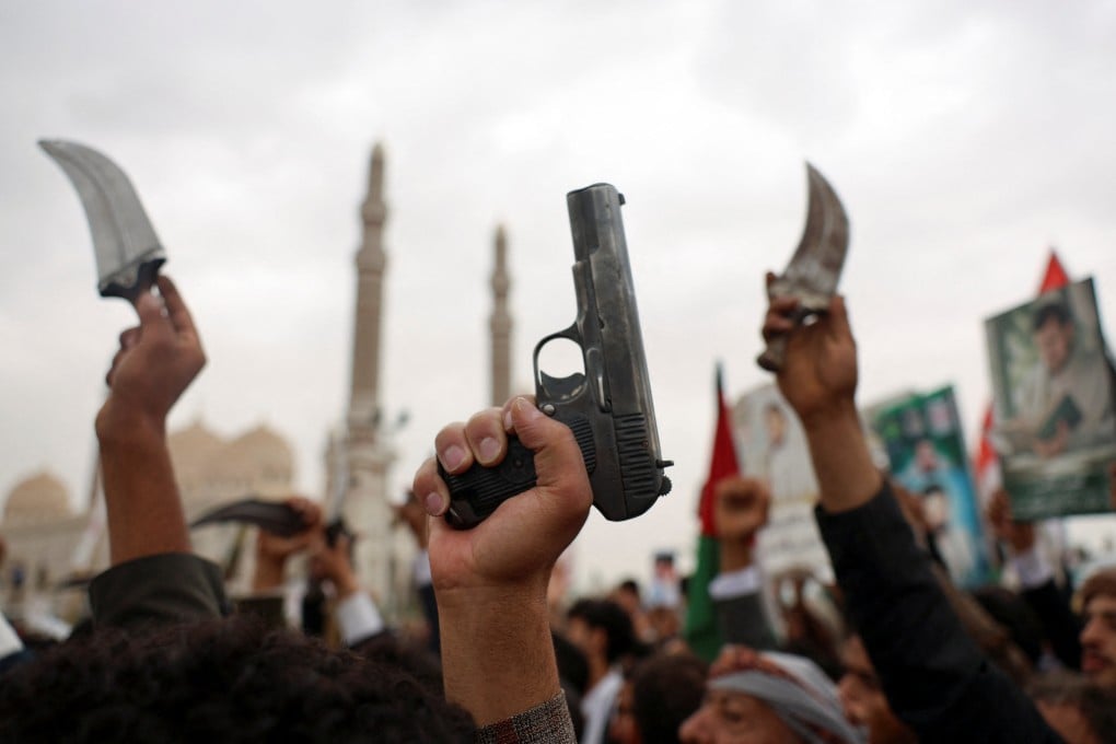 Protesters in Sanaa, Yemen hold up weapons as they join thousands of people, mainly Houthi supporters, during a rally to show solidarity with Palestinians in Gaza. Photo: Reuters