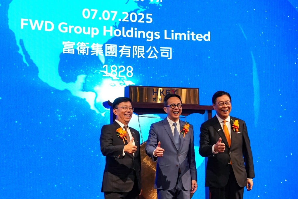 FWD Group’s chairman Fred Ma (right), founder Richard Li (center) and CEO Huynh Thanh Phong (left), during the insurer’s trading debut on the Hong Kong stock exchange on July 7, 2025. Photo: Sun Yeung