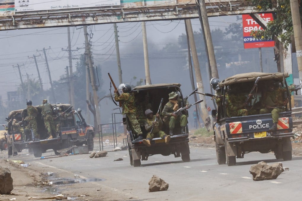 Riot police ride in their vehicles, shooting tear gas during clashes with demonstrators during anti-government protest in Nairobi, Kenya on Monday. Photo: Reuters