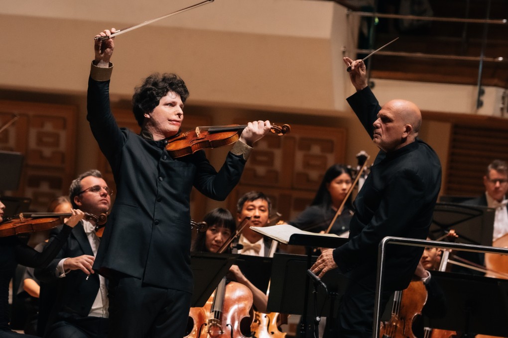 Jaap van Zweden (front right) conducts the Hong Kong Philharmonic Orchestra and violinist Augustin Hadelich (front left) at the orchestra’s season-closing concert on July 4. Photo: Desmond Chan/HK Phil