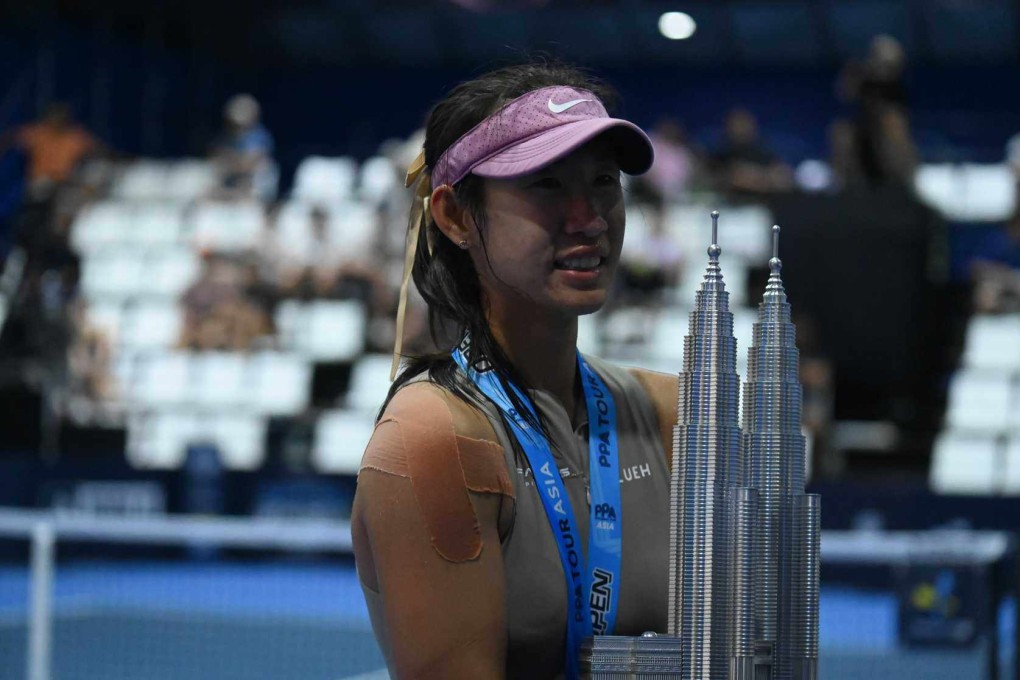 Long Yufei with her women’s singles trophy at the Panas Malaysia Open on Sunday. Photo: PPA Tour Asia