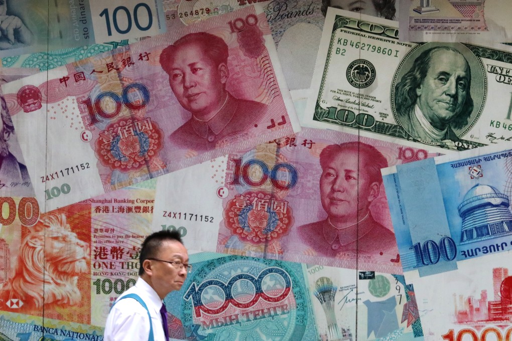 A man walks by a currency exchange outlet in Central. Photo: Felix Wong