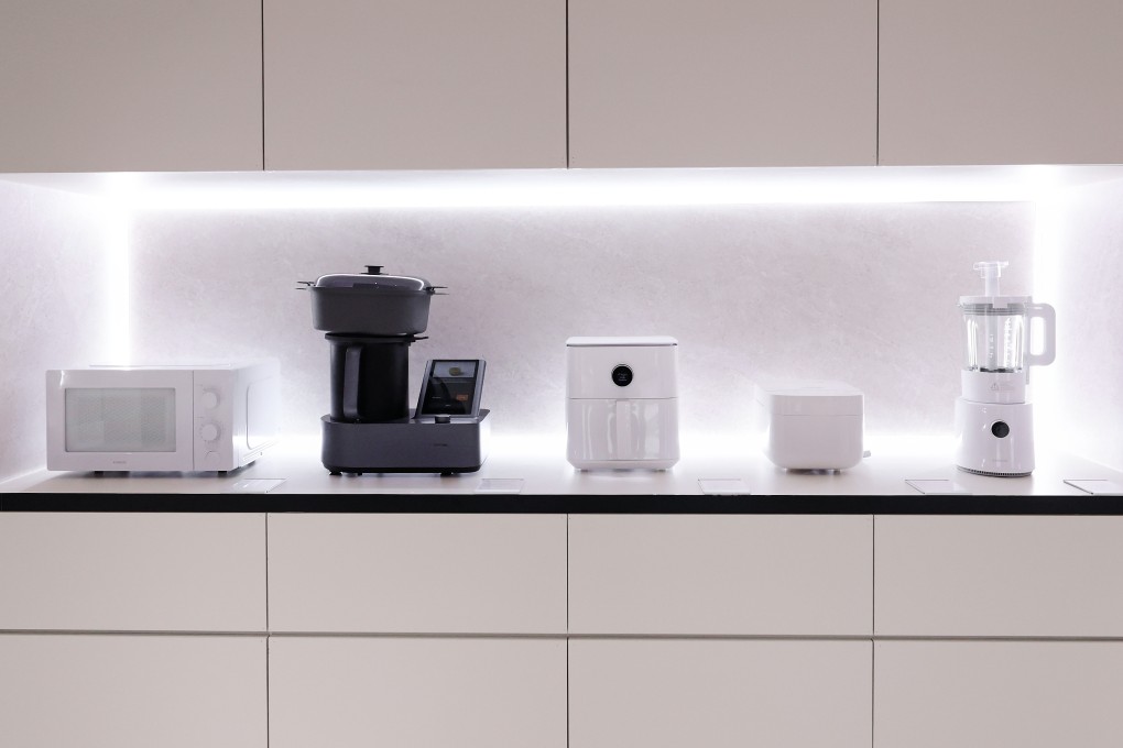 Xiaomi showcases its collection of small kitchen appliances. Photo: Getty Images