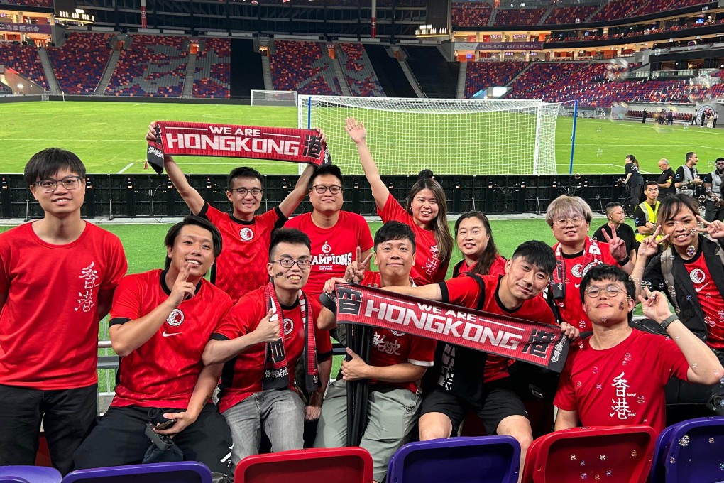 Calvin Choi, seen here on the right holding a scarf, with fellow Chi Sin Lo core members. The group will travel to South Korea to watch Hong Kong in the East Asian Football Championship. Photo: Calvin Choi