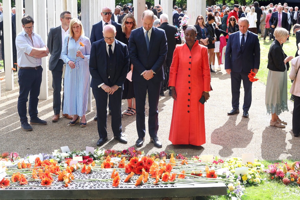 Britain’s Prince William stands with London bombings survivor Thelma Stober during a memorial service for the 20th anniversary of the 7/7 London bombings at Memorial Gardens in Hyde Park, London on Monday. Photo: Pool via Reuters