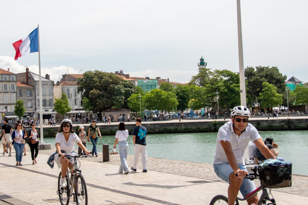 Cyclists ride along the harbourfront in La Rochelle, France. The section of France’s La Vélodyssée between Les Sables d’Olonne and La Rochelle is particularly rewarding for history enthusiasts. Photo: Shutterstock