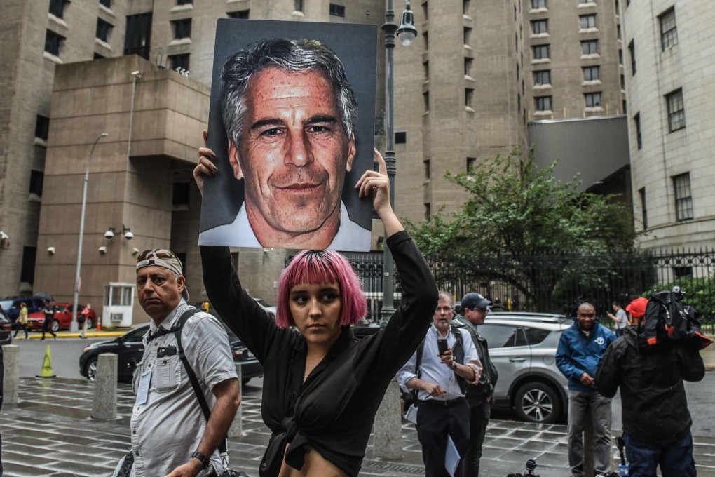 A protester holds up a large picture of Jeffrey Epstein in front of the Metropolitan Correction Centre in New York in 2019. File photo: AFP