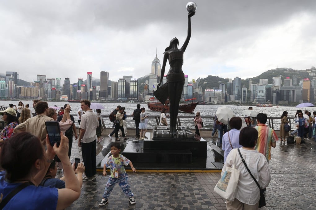 People throng the Tsim Sha Tsui waterfront on the July 1 holiday this year. No doubt New World Development has benefitted from the revitalisation of the promenade, but the project has also created a more vibrant and welcoming waterfront for everyone. Photo: Jelly Tse