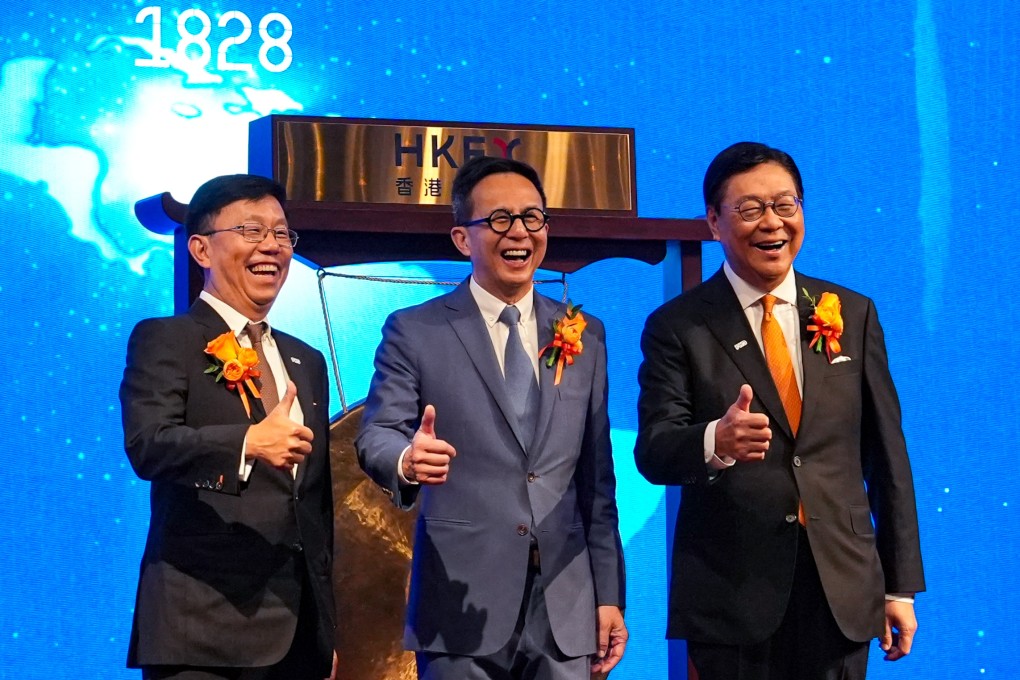 From the left, FWD Group’s CEO Huynh Thanh Phong, founder Richard Li and chairman Frederick Ma Si-hang celebrate the pan-Asian insurer’s trading debut on the Hong Kong stock exchange on July 7. Photo: Sun Yeung