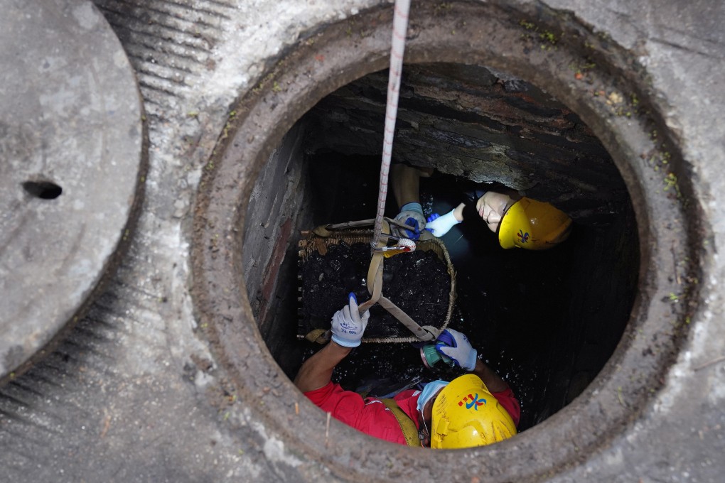 Workers clear and dredge the pipelines of Fushougou Ditch in the ancient city of Ganzhou, in central China’s Jiangxi province, last month. Photo: Xinhua