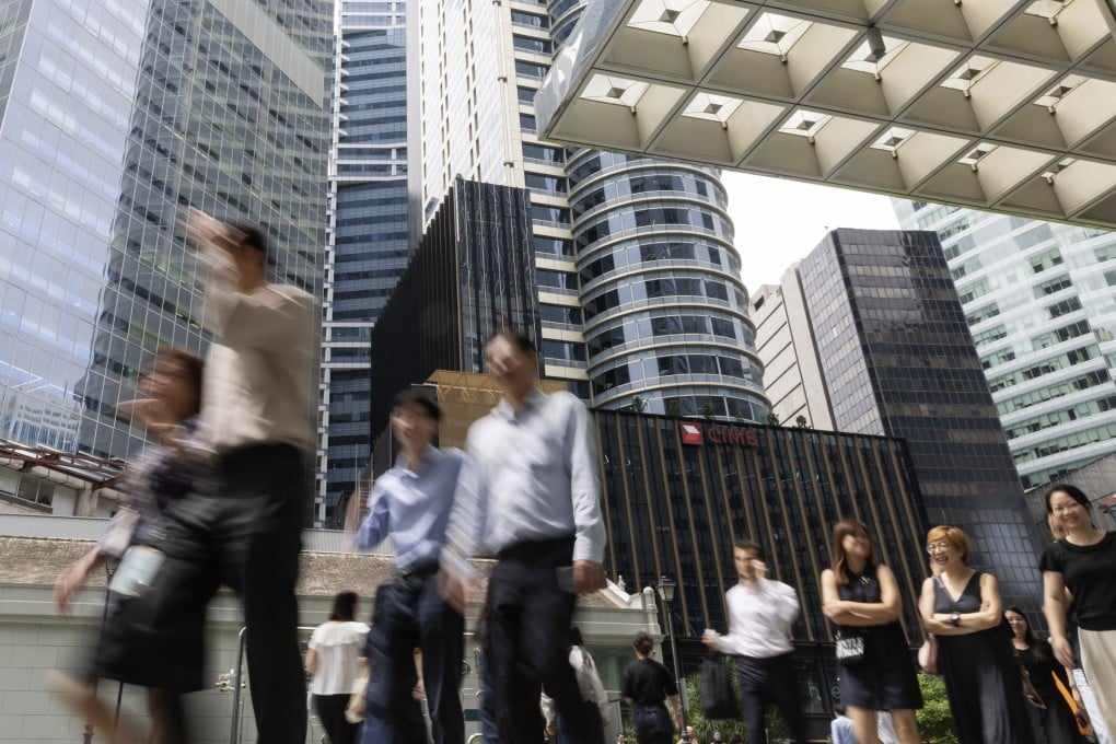 Office workers in Singapore’s Central Business District. Photo: EPA-EFE