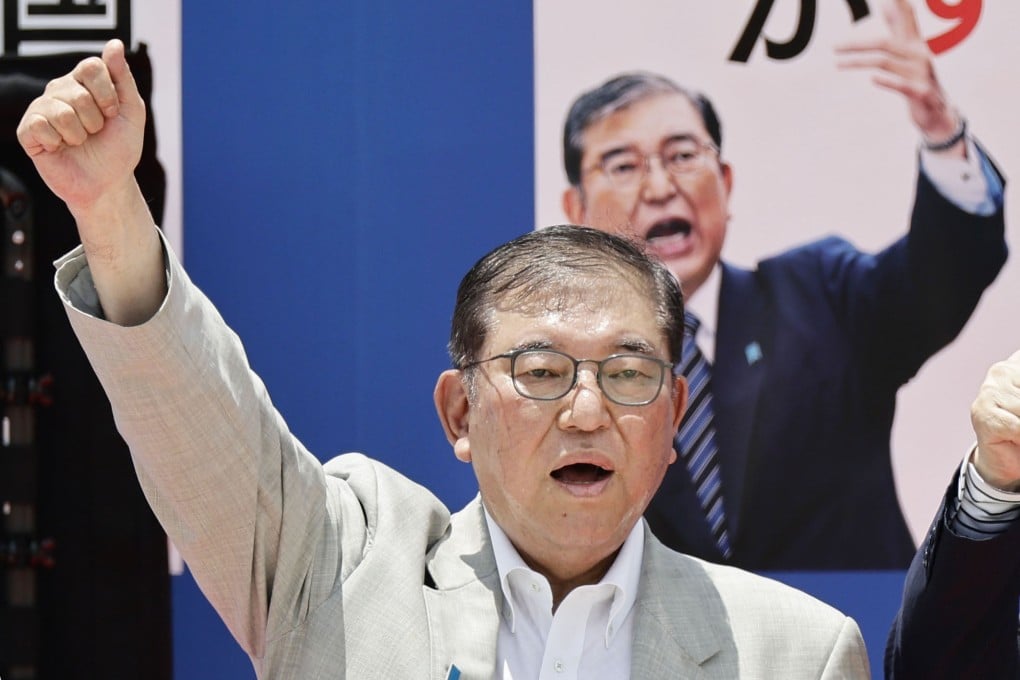 Japanese Prime Minister Shigeru Ishiba, leader of the ruling Liberal Democratic Party, raises his fist after delivering a speech in the southwestern Japan city of Kagoshima on Monday. Photo: Kyodo