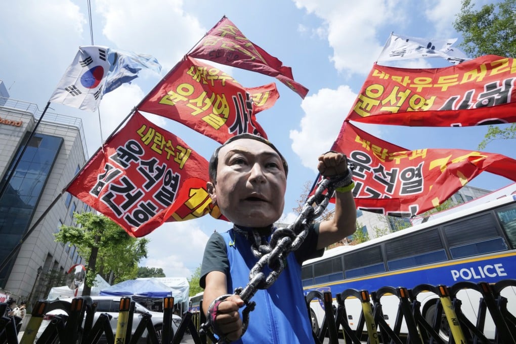 A supporter wears a Yoon Suk-yeol mask during a protest near the Seoul Central District Court on Wednesday. Photo: AP