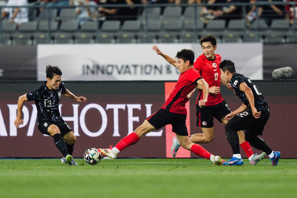 Sun Ming-him puts his foot in to challenge scorer Kang Sang-yoon. Photo: HKFA